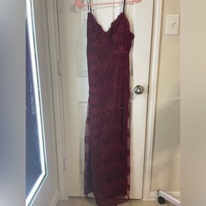Burgundy lace dress. Slit on the front side of the dress.